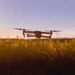 Agriculture Technology - Black Quadcopter Drone on Green Grass Field