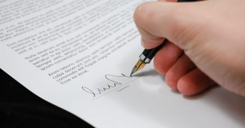 Legal Documents - Person Signing in Documentation Paper